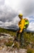 Scotty Delta Hand Pump Backpack on Wildland Firefighter - Side View