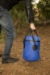 Stansport 12 Liter Outdoor Trail Bucket with Lid carried by person
