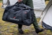 True North Gear Fire Base Duffel - Person Carrying Duffel at Fire Camp